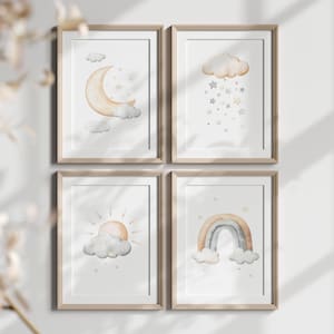 May include: Four framed watercolour art prints with celestial themes. Each print depicts a different design: a crescent moon, a cloud with falling stars, a sun with clouds, and a rainbow. The artwork uses soft pastel colours, ideal for a nursery or children's room.