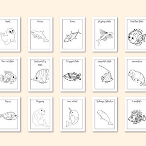 Op de afbeelding: Een verzameling van 15 kaarten met zwart-wit illustraties van verschillende zeedieren, waaronder een zeehond, orka, tonijn, vliegende vis en kogelvis. Elke kaart heeft de naam van het dier.