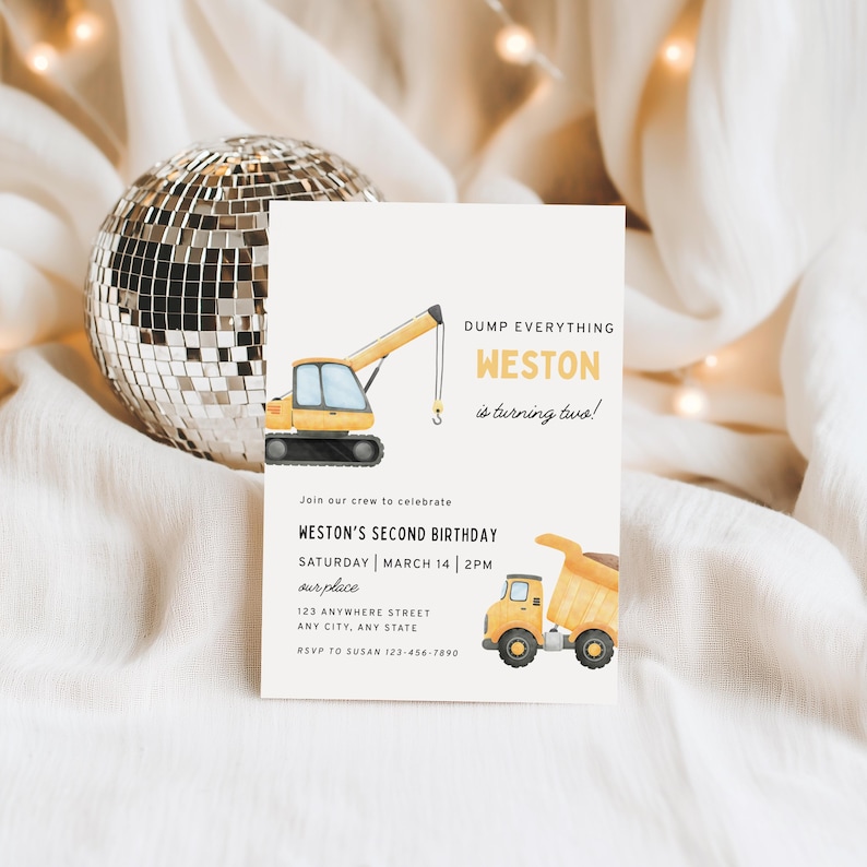 May include: A birthday invitation with a construction theme. The invitation features illustrations of a yellow crane and a dump truck. The text reads "DUMP EVERYTHING WESTON is turning two!" and includes party details.