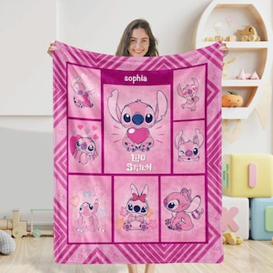 May include: A pink fleece blanket featuring the character Stitch from Lilo & Stitch. The blanket has a repeating pattern of Stitch in various poses, with the name "Sophia" at the top. The blanket is approximately 60 x 50 inches.