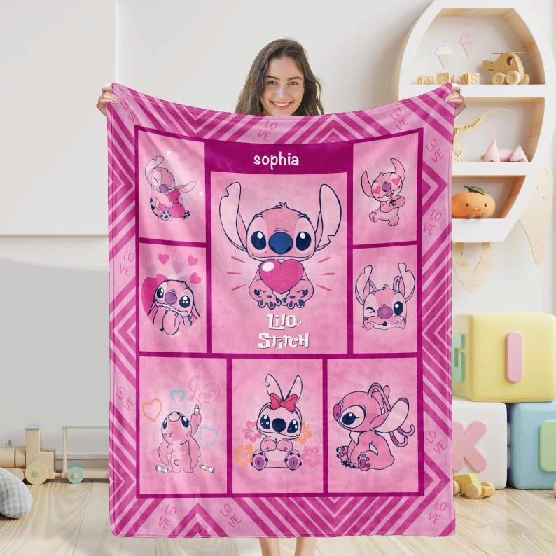 May include: A pink fleece blanket featuring the character Stitch from Lilo & Stitch. The blanket has a repeating pattern of Stitch in various poses, with the name "Sophia" at the top. The blanket is approximately 60 x 50 inches.