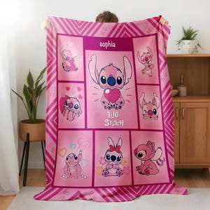 May include: A pink and white blanket featuring the character Stitch from Lilo & Stitch. The blanket has a repeating pattern of Stitch in various poses, hearts, and the name "Sophia". The border has a chevron design with the word "Love".