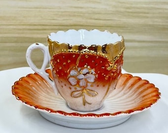 Vintage high-relief orange demitasse cup and saucer set; made in Japan, hand painted