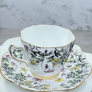 Vintage Rosina Bone China flat tea cup and saucer made in England green yellow and pink floral design with gold trim 1950s Pattern 5180