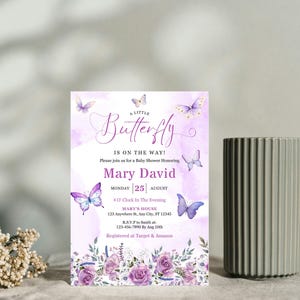 May include: A baby shower invitation with a watercolor background and butterfly illustrations. The invitation reads "A Little Butterfly Is On The Way!" and includes details for Mary David's baby shower, including the date, time, and location.
