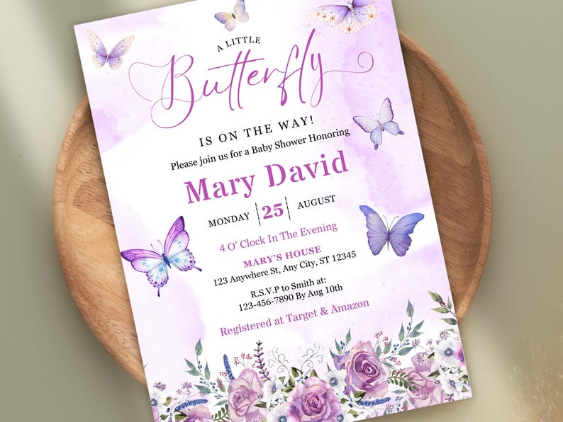 May include: A baby shower invitation with a watercolor design. The invitation features the text "A Little Butterfly Is On The Way!" in a script font, along with the names "Mary David" and event details. Purple butterflies and floral accents decorate the invitation.