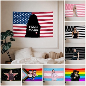 May include: American flag tapestry with a black silhouette and the text "YOUR IMAGE" in white. The tapestry features red and white stripes and a blue field with white stars. Additional tapestries with various designs are also shown.