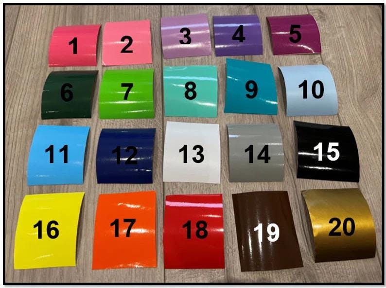May include: Twenty colour swatches arranged in four rows of five. The swatches are numbered 1 through 20. The colours include pink, green, blue, white, grey, black, yellow, orange, red, and gold.