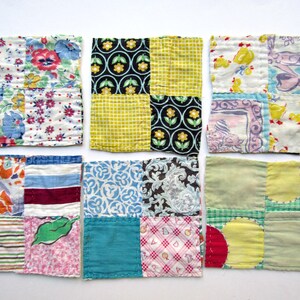 May include: Six square fabric coasters, each constructed from four distinct patches of cotton textile. The patches feature a variety of colorful patterns, including floral prints, geometric grids, paisley motifs, and solid blocks in shades of red, blue, yellow, green, and black.