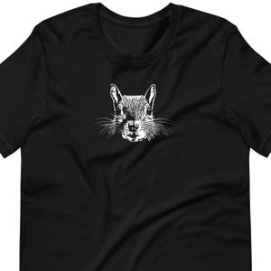 May include: A black t-shirt with a white graphic of a squirrel's face.