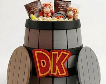May include: A giant barrel with the text "GIANT DK BARREL - NEW COLOR AND LID OPTIONS". The barrel is split into brown and gray sections, with matching lid options. The barrel contains snacks and monkey toys.