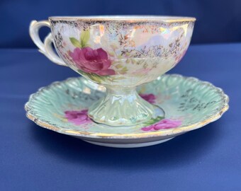 Handpainted tea cup and saucer