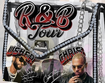 May include: Clear handbag with a black trim, silver chain strap, and rhinestone accents. The bag features the text "R&B Tour" in red and black, along with images of Usher and Chris Brown, and their signatures.