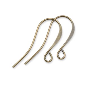 May include: Two antique gold-toned earring hooks. The hooks are made of metal and have a smooth, slightly textured finish.