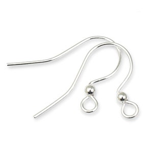 May include: Two silver earring hooks with a small ball at the end of each hook.