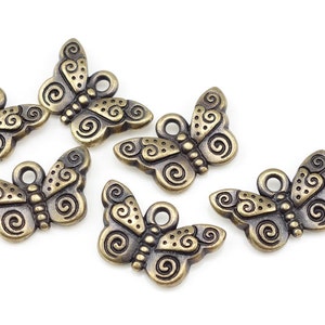 Antiguos Amuletos de latón Mariposa Encantos TierraCast Spiral Butterfly Summer Charms Insect Charms Bug Charms Bronze Charms P1096 imagen 1