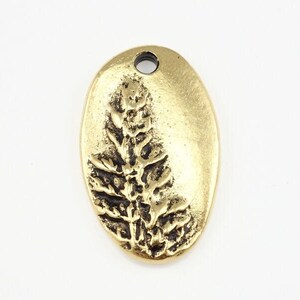 May include: Gold-toned oval pendant with a raised design of a fern leaf.