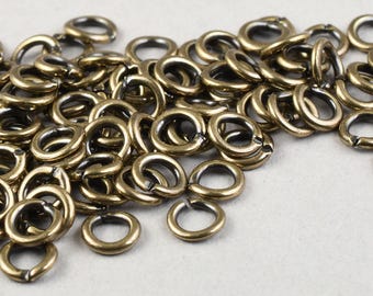 100 Pieces of 4mm 20 Gauge Open Jump Ring Findings - ANTIQUE BRASS Plated 20g Jumprings - Machine Cut Rings 4mm OD Outer Diameter    #FB945
