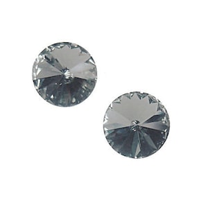 May include: Two clear crystal rhinestones with a faceted design.