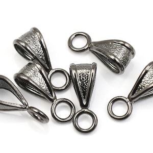 May include: Six black metal pendant bails with a textured finish. Each bail has a loop at the top and a loop at the bottom.