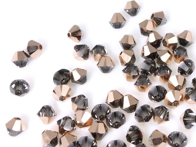 48 CRYSTAL ROSE GOLD Swarovski 4mm Bicone Beads Special Crystal Coating Effect Grey and Rose Gold Highlights Article 5328 image 1