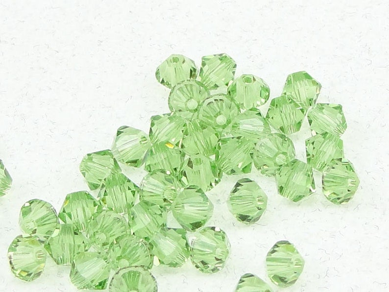 48 PERIDOT GREEN 4mm Swarovski Bicone Beads Light Green Beads Article 5328 4mm Bicones image 1