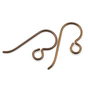 May include: Two bronze-colored earring hooks. The hooks are made of metal and have a smooth finish.