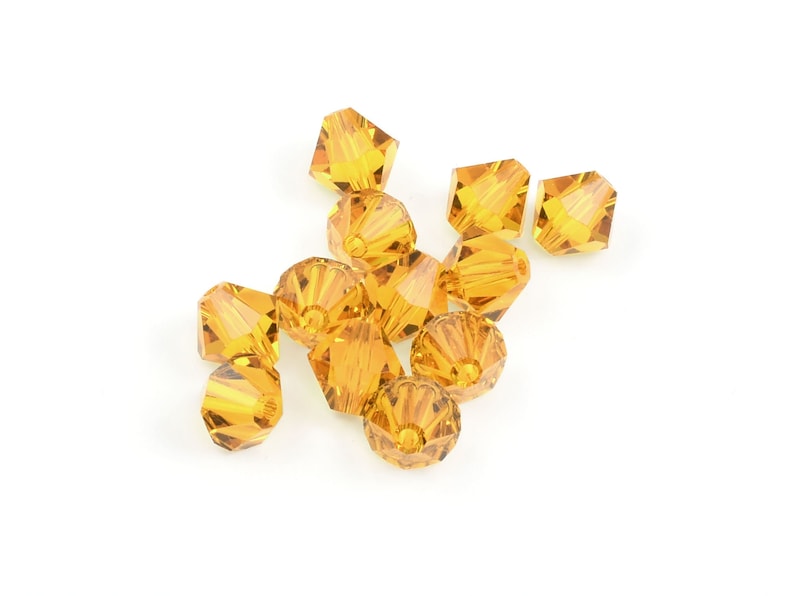 12 6mm TOPAZ Swarovski Crystal Beads 5328 Xilion Bicone Beads 6mm Beads in Warm Amber Brown image 1