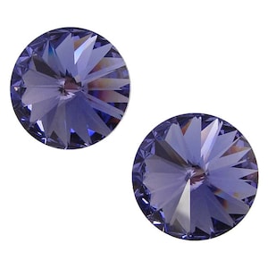 May include: Two round, purple, faceted glass rhinestones with a starburst design.