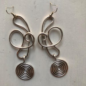 wire wrapped hammered silver metal earrings