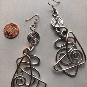 wire wrapped hammered silver metal earrings
