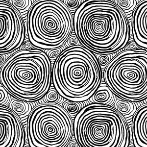 May include: Fabric with a black and white design of concentric circles, similar to tree rings. The pattern includes large, irregular circles and smaller, swirling patterns. A ruler is visible along the bottom edge, showing measurements.