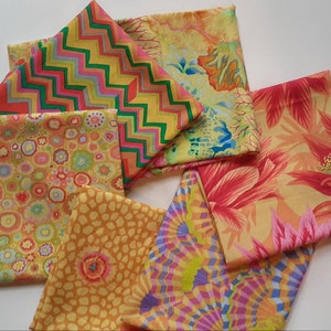 May include: Five fabric squares in various patterns and colors. The patterns include a geometric chevron, a floral design, a polka dot pattern, a small floral pattern, and a geometric pattern with a swirling design. The colors include yellow, orange, pink, green, and blue.