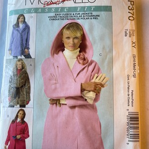 May include: A sewing pattern for a fleece or fur jacket. The pattern is for sizes small, medium, and large. The pattern is called "Classic Fit" and is from McCall's.