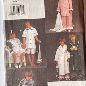 May include: A sewing pattern for children's pajamas and robes. The pattern includes four different styles: a striped pajama set, a white robe with red trim, a black and white plaid pajama set, and a white robe with a black trim. The pattern is for sizes 5-6-6X.