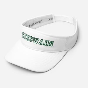 May include: White visor with a green embroidered "COXSWAIN" text.