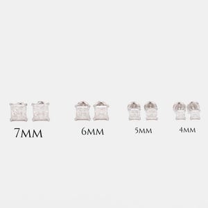 May include: Four pairs of square-cut stud earrings in varying sizes: 7mm, 6mm, 5mm, and 4mm. The earrings are displayed on a light background, showcasing their sparkling facets. The sizes are labeled in black text.