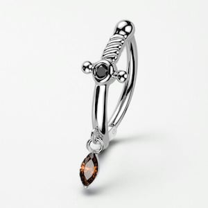 May include: A silver-colored earring with a dagger design. The earring features a curved bar with a dagger-shaped charm and a dangling, teardrop-shaped, brown gemstone. The dagger has a black gemstone in the center.