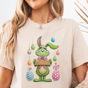 Funny Grinch Easter Shirt Grinch&#39;s Easter Surprise Happy  Bunny Ears, Eggs, and Mischief in Every Hop T-shirt For Easter Party