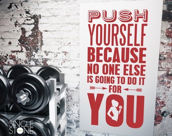 May include: Motivational poster with red text that reads "Push Yourself Because No One Else Is Going To Do It For You." The poster is hanging on a brick wall with weights in the foreground.