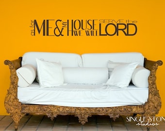 May include: A white couch with pillows in front of a yellow wall with a brown vinyl decal that reads "As for me and my house, we will serve the Lord."