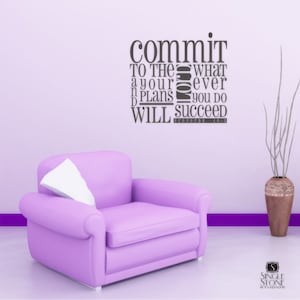 May include: A purple armchair with a white cushion in front of a light purple wall with a motivational quote that reads "commit to the whatever your plans you do will succeed Proverbs 16:3".