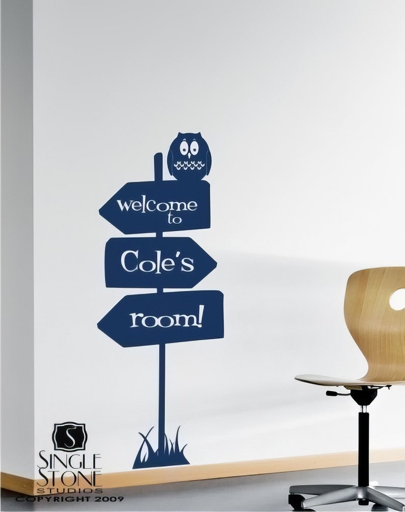 May include: A blue and white sign with an owl on top that says "welcome to Cole's room!"