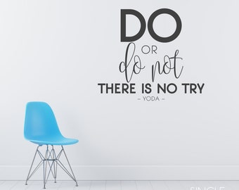 May include: A blue chair sits in front of a white wall with a black and white motivational quote that reads "DO OR do not THERE IS NO TRY -YODA- "