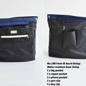 May include: Black tote bag with a navy blue top section. Features a white zipper pocket, a big pocket, and a small silver tag. The text on the image reads "No.108 Front & bacck lining: Water resistant base lining". Includes a phone pocket, pen slip, and key clip.