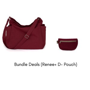 May include: A burgundy shoulder bag with multiple pockets and a matching small pouch. The bag has a long adjustable strap and a silver-colored buckle. The pouch has a zipper closure and a small striped accent.
