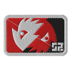 May include: Embroidered patch with a stylized design in red, white, and black. The design features a split face with sharp angles and the number "52" in the lower right corner. The patch has a gray border.