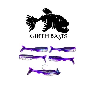 May include: Five purple and white soft plastic fishing lures with a black and white fish skeleton logo and the text "Girth Baits".