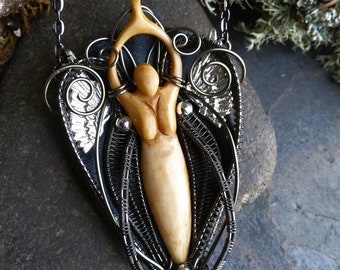 Carved Bone Goddess Pendant with Silver Wings.