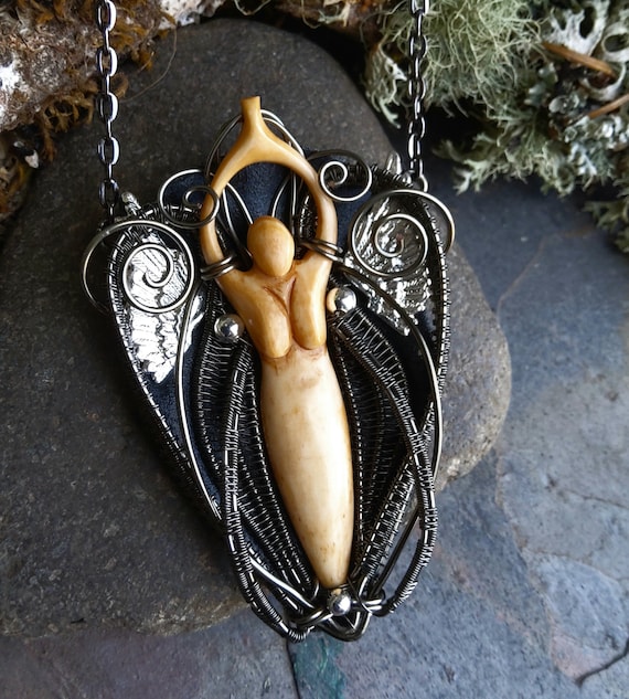 Carved Bone Goddess Pendant with Silver Wings.